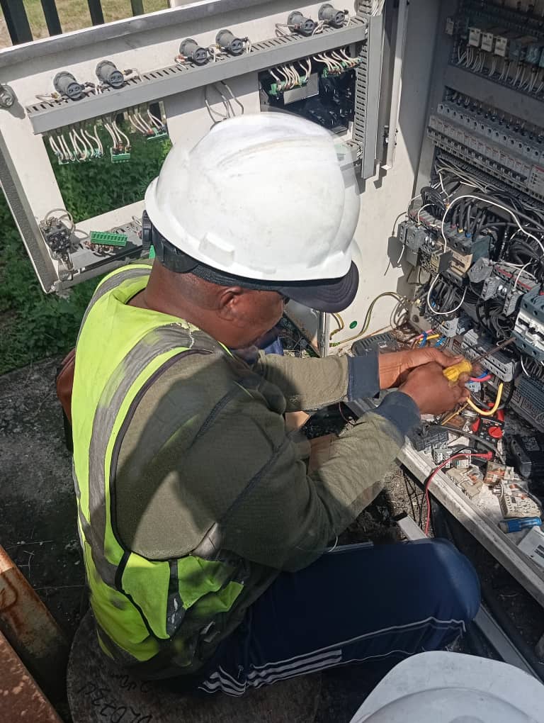 Engineer working on an Automatic Transfer System panel